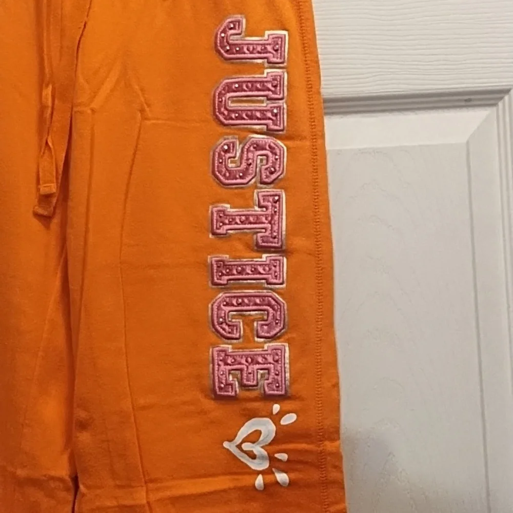 Justice Orange Sweatpants with Text Graphics
